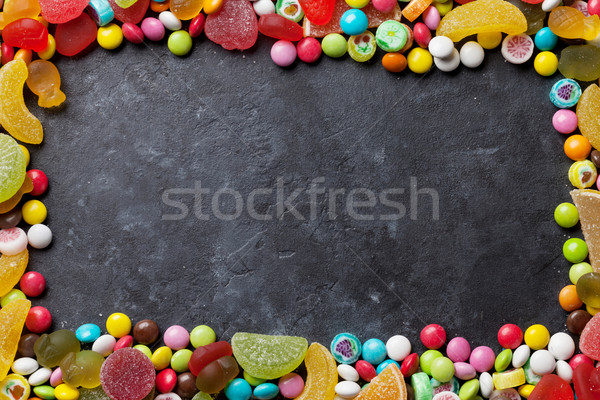 Colorful candies, jelly and marmalade over stone Stock photo © karandaev