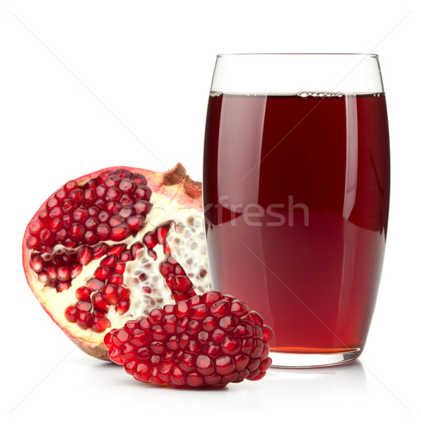 Pomegranate juice in a glass and ripe pomegranate Stock photo © karandaev