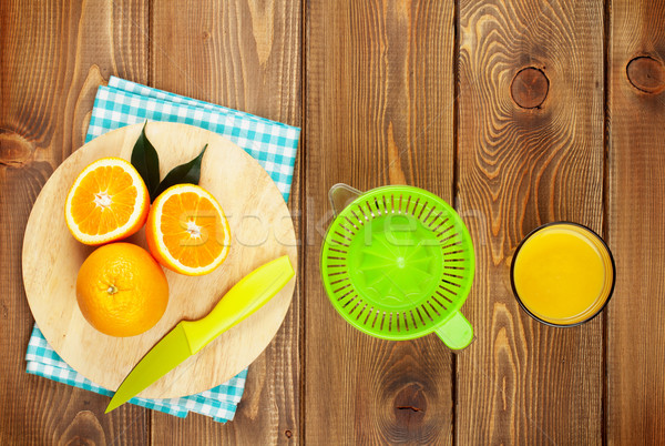 Orange fruits and glass of juice Stock photo © karandaev
