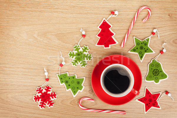 Coffee cup and christmas decor on wooden background Stock photo © karandaev