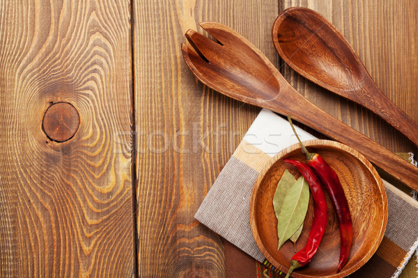 Wood kitchen utensils over wooden table background Stock photo © karandaev