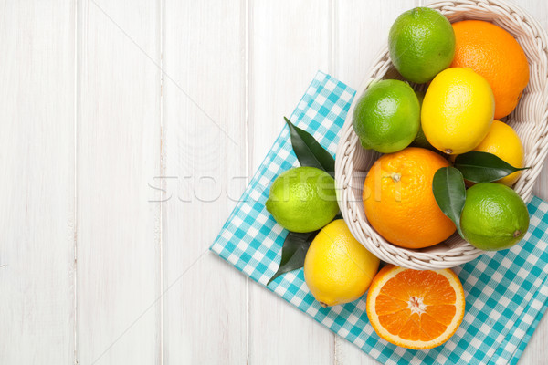 Cítrico frutas cesta laranjas limões branco Foto stock © karandaev