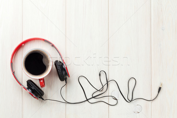 Headphones and coffee cup Stock photo © karandaev