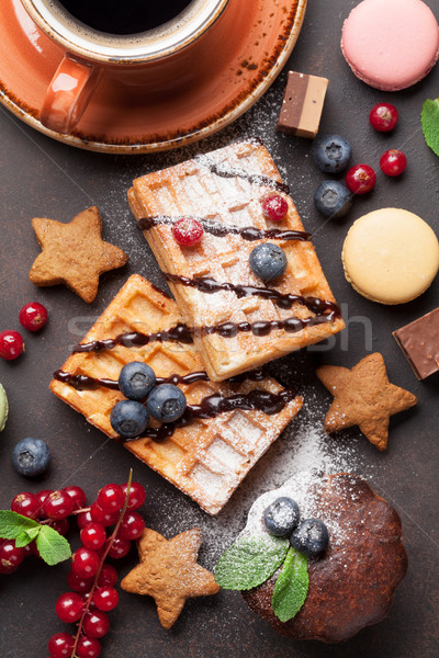 Coffee, sweets and waffles with berries Stock photo © karandaev