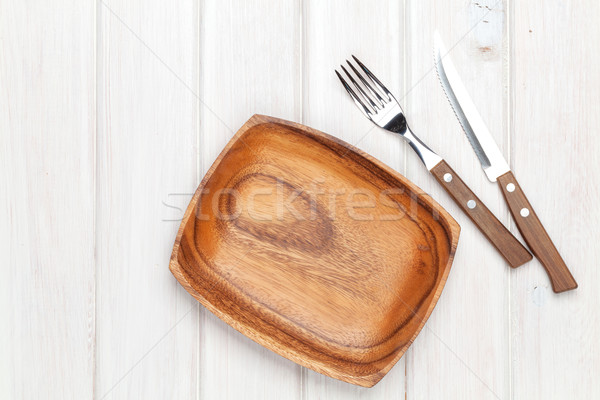 Kitchen utensils over white wooden table background Stock photo © karandaev