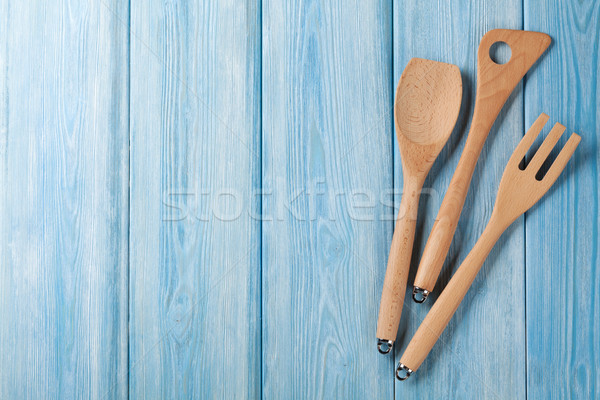 Kitchen cooking utensils over wooden table Stock photo © karandaev