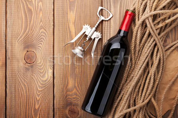 [[stock_photo]]: Vin · rouge · bouteille · tire-bouchon · table · en · bois · haut · vue
