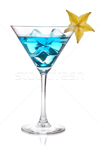 Blue cocktail with carambola in martini glass Stock photo © karandaev