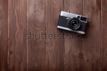 Stock photo: Vintage film camera on wooden table