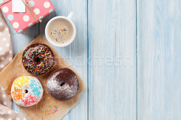 Donuts, gift box and coffee Stock photo © karandaev