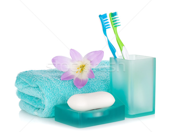 Toothbrushes, soap, towel and flower Stock photo © karandaev