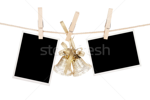 Blank photo frames and christmas decor hanging on the clotheslin Stock photo © karandaev