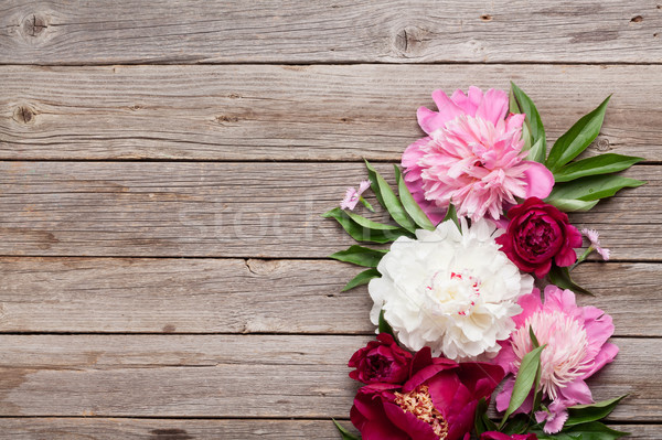 Stock photo: Garden peony flowers on wood