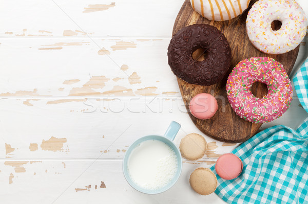 Lait donuts table en bois haut vue espace de copie [[stock_photo]] © karandaev