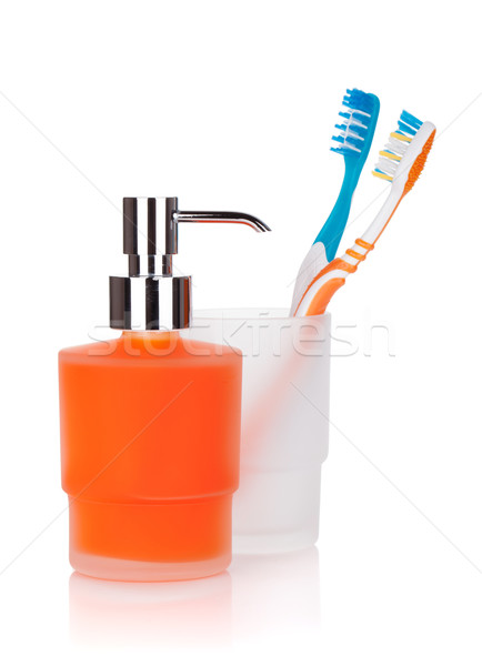 Two colorful toothbrushes and liquid soap Stock photo © karandaev
