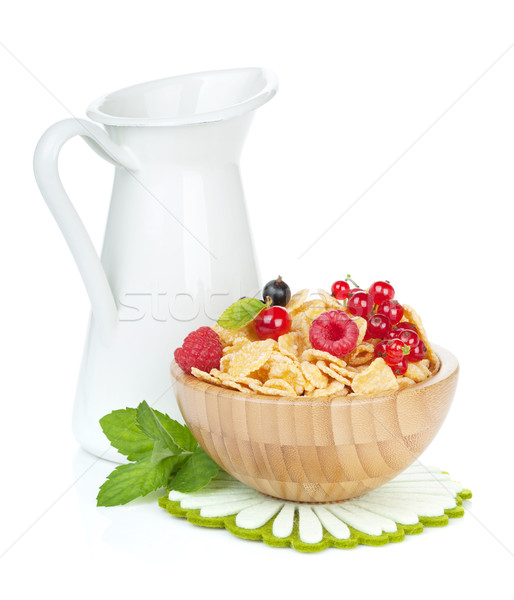 Fresh corn flakes with berries and milk jug Stock photo © karandaev