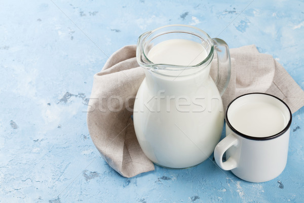 Milk jug and cup Stock photo © karandaev