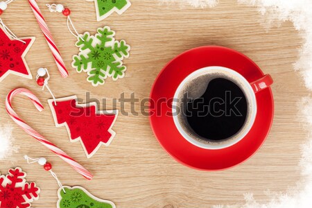 Autumn leaves and coffee cup over wood background Stock photo © karandaev