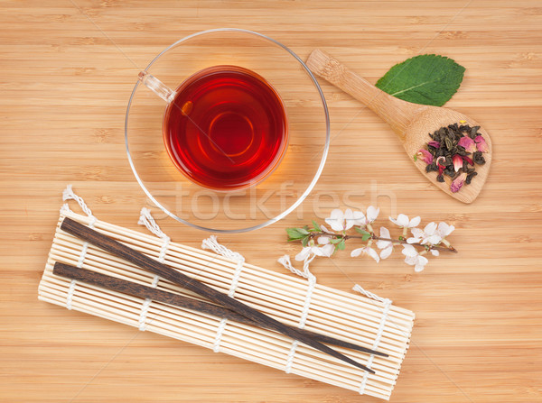 Stock photo: Japanese green tea and sakura branch