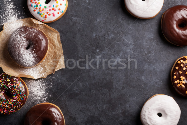 Farbenreich Donuts Stein Tabelle top Ansicht Stock foto © karandaev