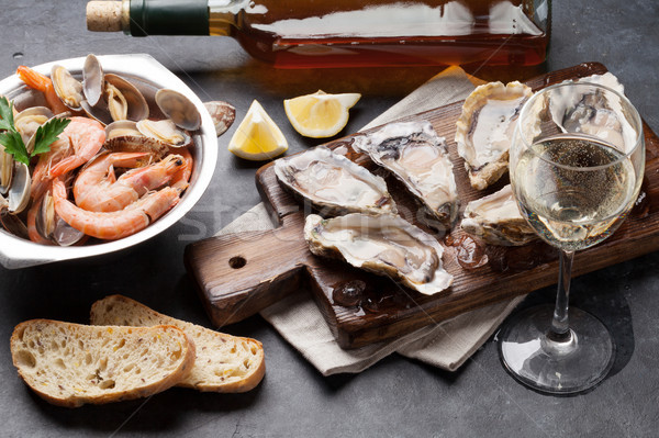 Fresh seafood and white wine Stock photo © karandaev