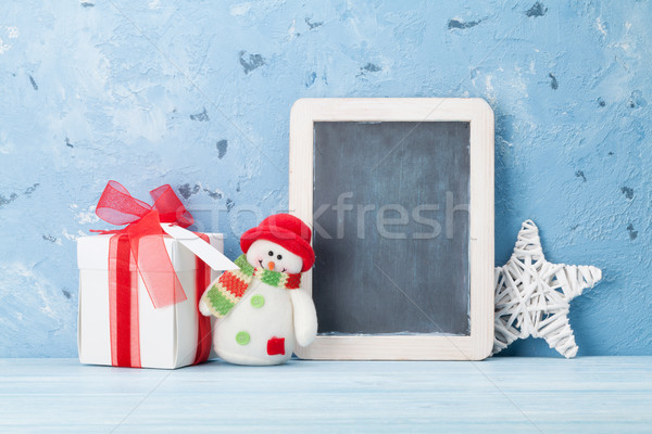 Christmas chalkboard, snowman and gift box Stock photo © karandaev