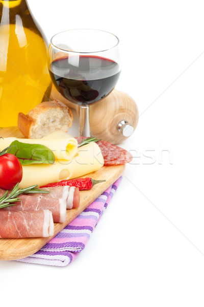 Red wine with cheese, prosciutto, bread, vegetables and spices Stock photo © karandaev