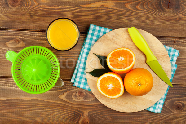 Orange fruits and glass of juice Stock photo © karandaev