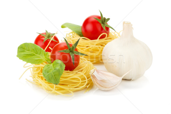 Cherry tomatoes, basil, garlic and pasta Stock photo © karandaev
