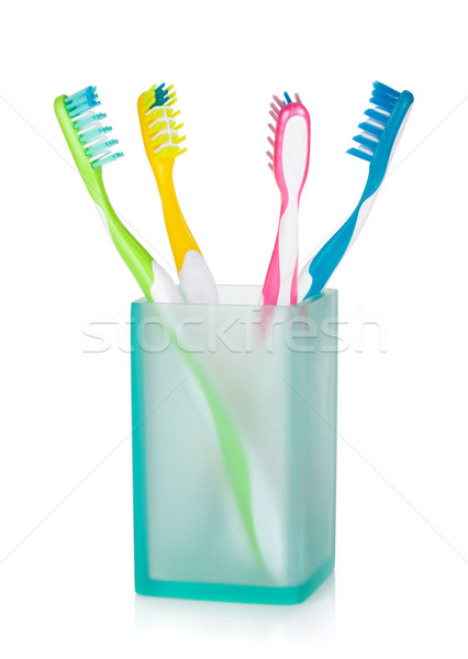 Four multicolored toothbrushes Stock photo © karandaev