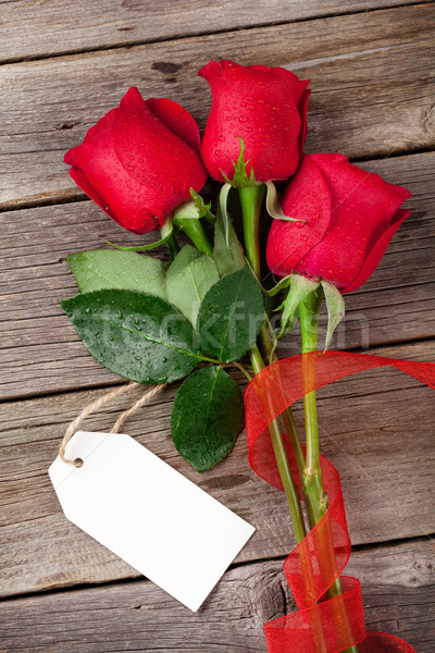 Valentine's day red roses over wood Stock photo © karandaev