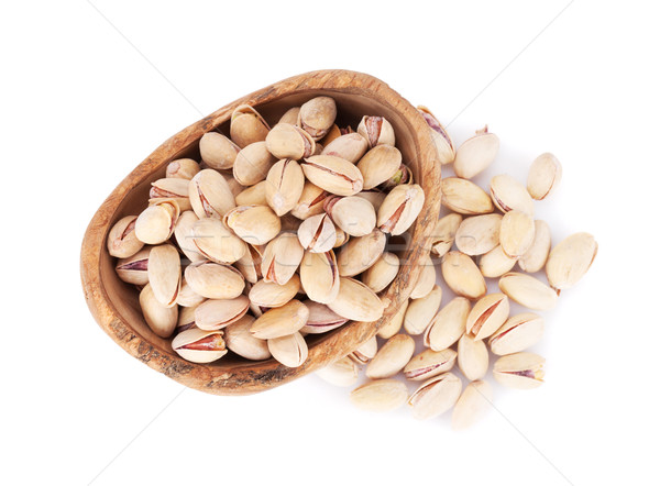 Pistachios nuts in bowl Stock photo © karandaev