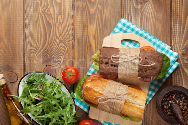 Two sandwiches with salad, ham, cheese and tomatoes Stock photo © karandaev