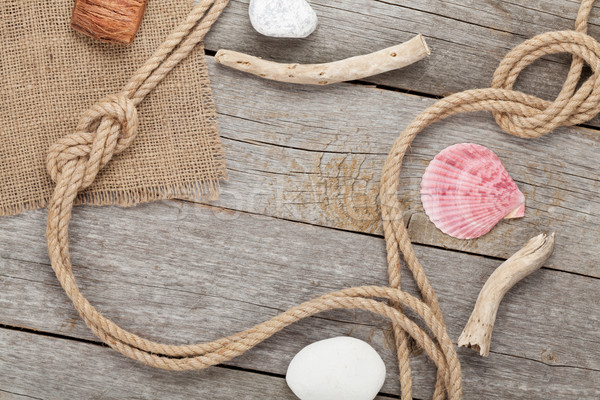 Stock photo: Ship rope on old wooden texture background