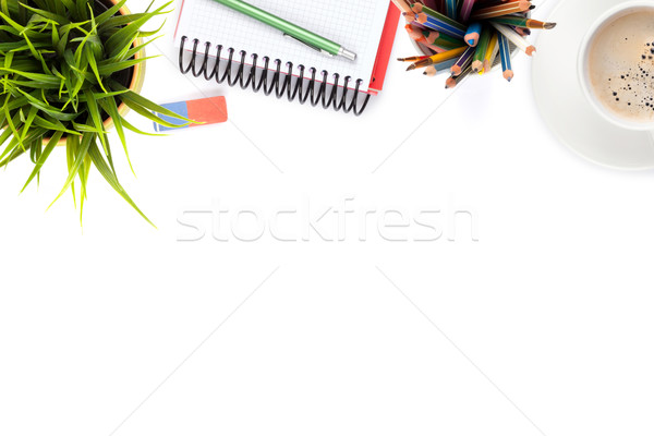 Office desk table with supplies, coffee cup and flower Stock photo © karandaev
