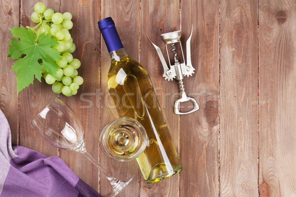 Bunch of grapes, white wine and corkscrew Stock photo © karandaev