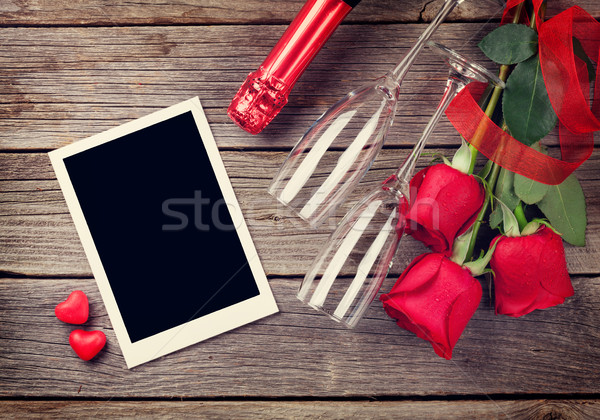 Valentines day photo frame, champagne and red roses Stock photo © karandaev