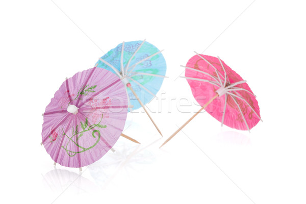 Three colored cocktail umbrellas Stock photo © karandaev