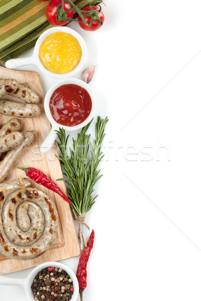 Gegrild worstjes ketchup mosterd geïsoleerd witte Stockfoto © karandaev