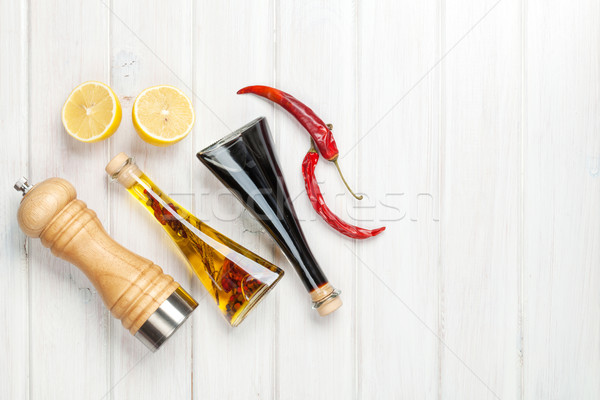 Condiments and spices over white wooden table Stock photo © karandaev