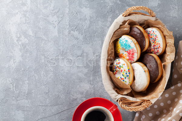 Colorful donuts and coffee cup Stock photo © karandaev