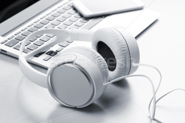 Headphones over laptop Stock photo © karandaev