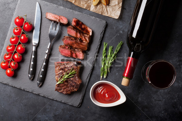 Grilled striploin steak and wine Stock photo © karandaev