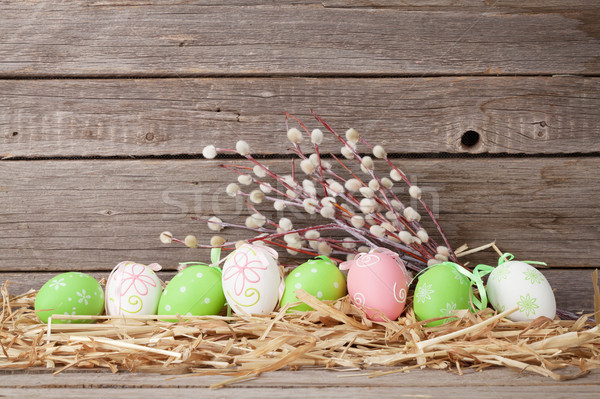 Easter eggs in front of wooden wall Stock photo © karandaev