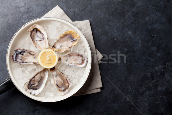 牡蠣 檸檬 冰 打開 石 表 商業照片 © karandaev