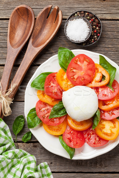 Caprese salad with tomatoes, basil and mozzarella Stock photo © karandaev