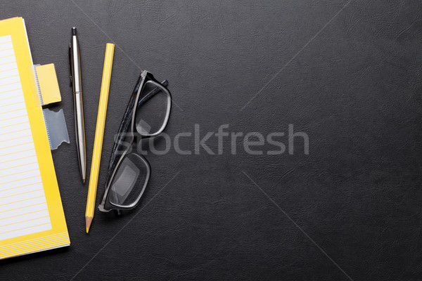 Office desk with notepad and supplies Stock photo © karandaev