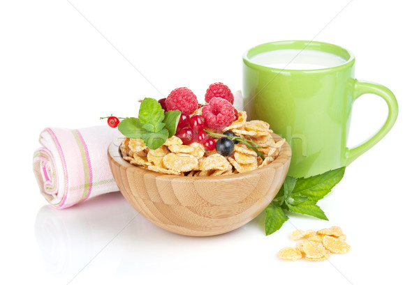 Fresh corn flakes with berries and milk Stock photo © karandaev