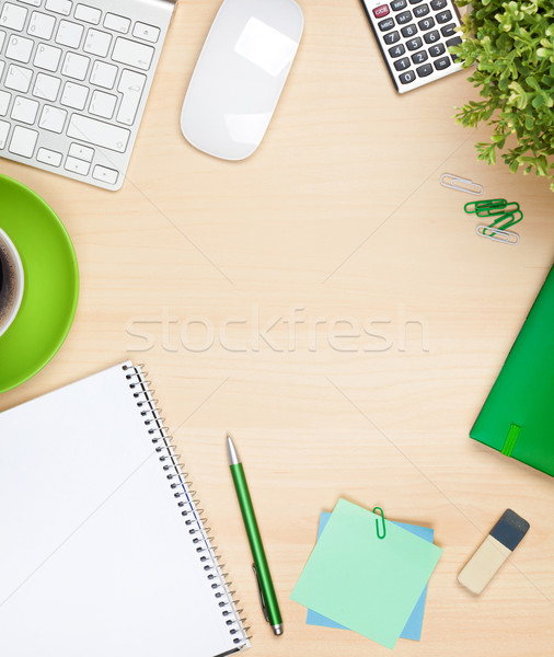 Office table with coffee cup, computer and flower Stock photo © karandaev