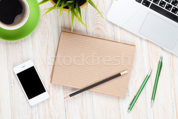 Office desk table with computer, supplies, coffee cup and flower Stock photo © karandaev